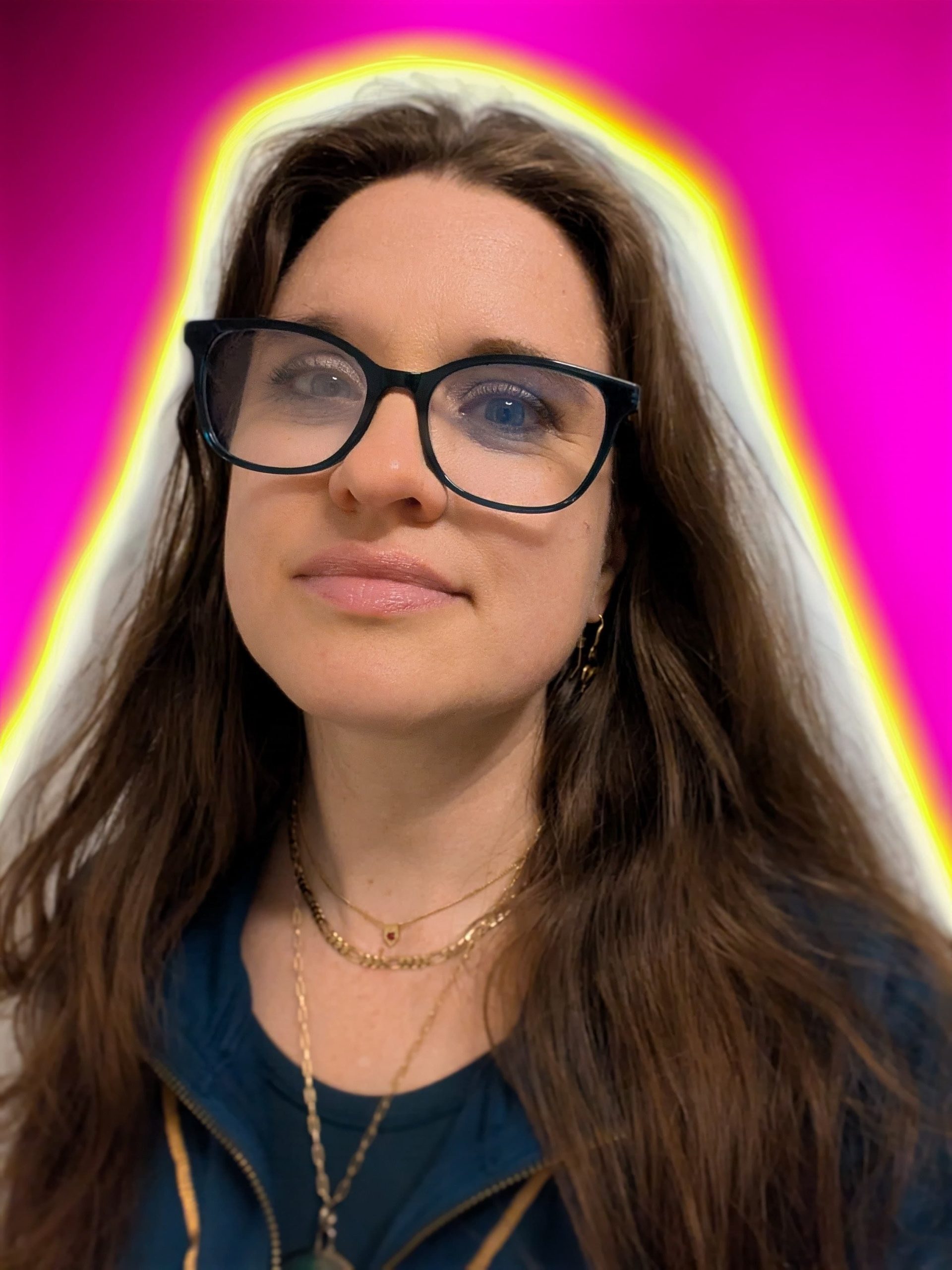 Stained glass style AI image of a regal-looking woman and a cybernetic-looking androgynous figure facing each other. The overall appearance is reds, oranges, and golds. The facial expression of the two figures is an almost dream-like peaceful gazing at one another.